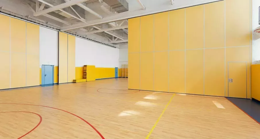 Sports hall divided by an operable wall